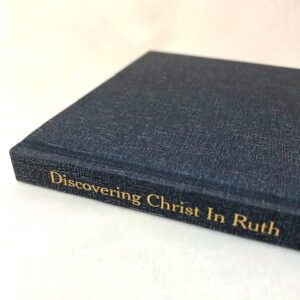A slim blue hardback book on a white background