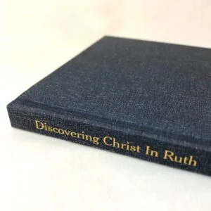 A slim blue hardback book on a white background