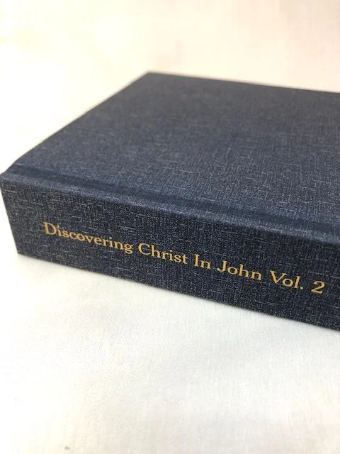 An image of a blue hardback book on a white background